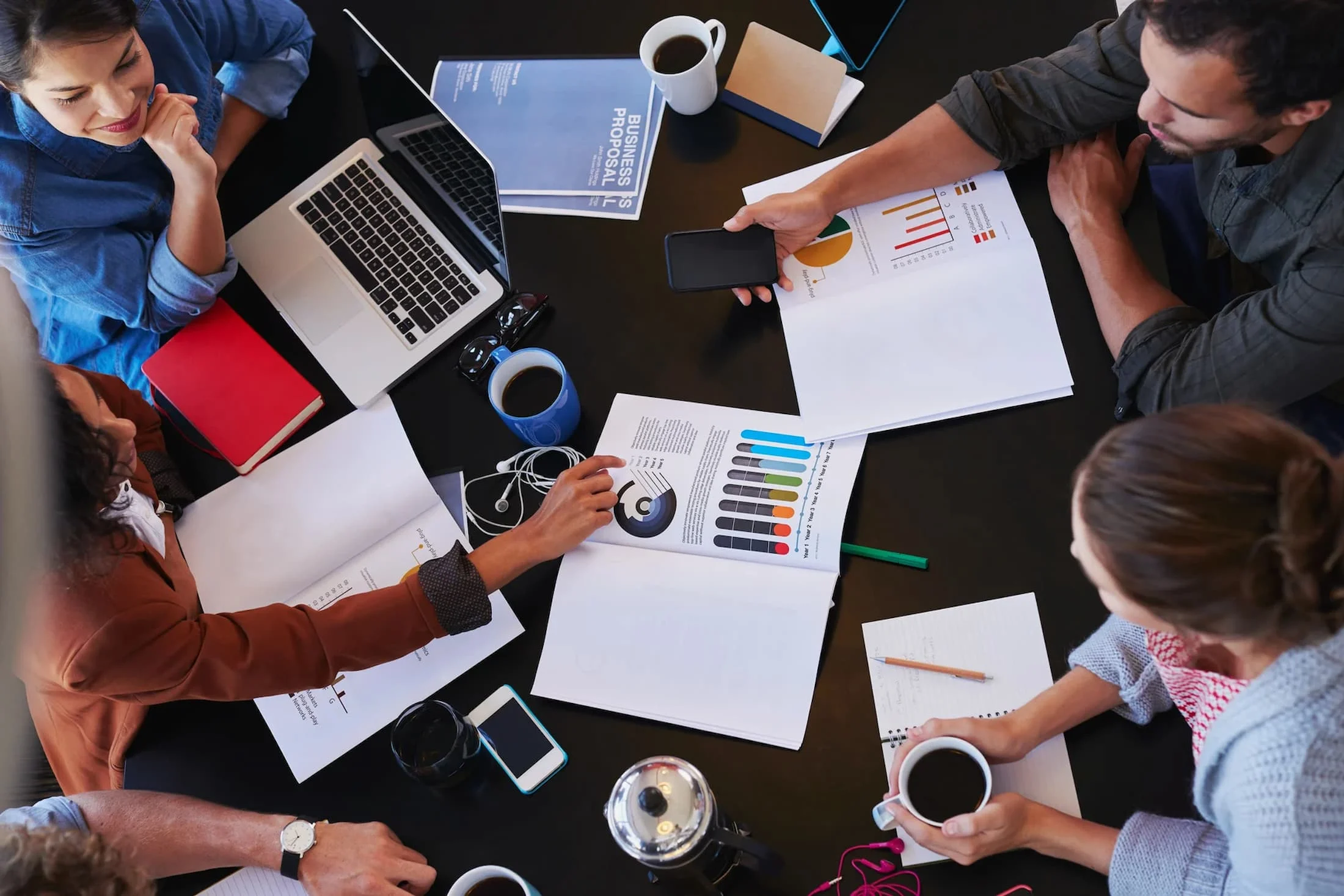 overhead-view-of-people-discussing-qualities-of-an-entrepreneur